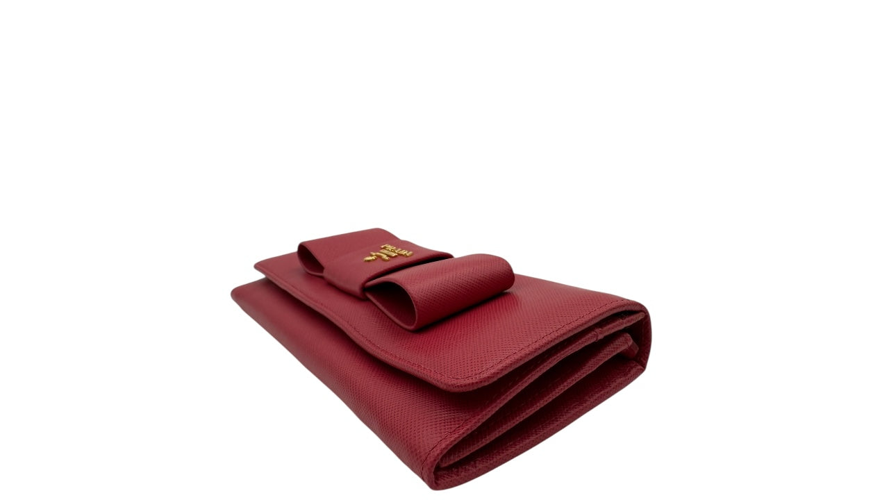 PRADA SAFFIANO LEATHER BOW CONTINENTAL FLAP WALLET PINK PEONIA