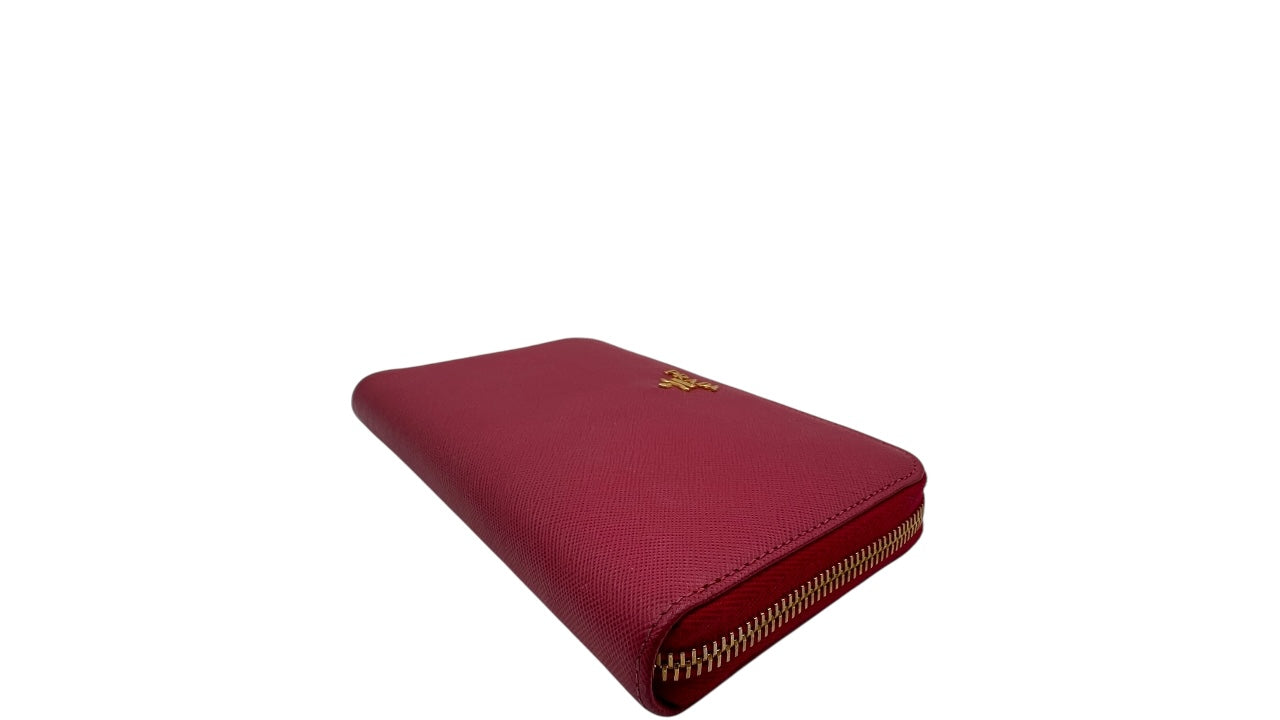 PRADA SAFFIANO LEATHER ZIPPY WALLET IN DEEP PINK