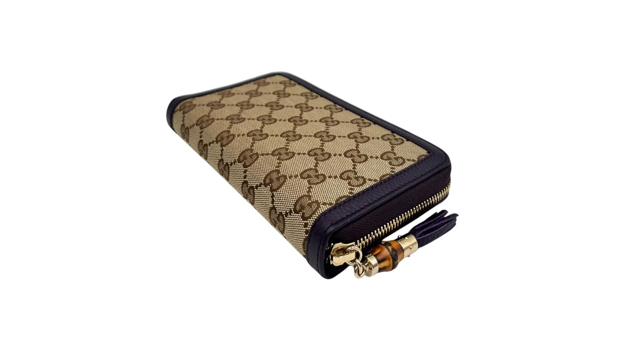 GUCCI GG CANVAS ZIPPY LONG WALLET WITH BAMBOO TASSEL