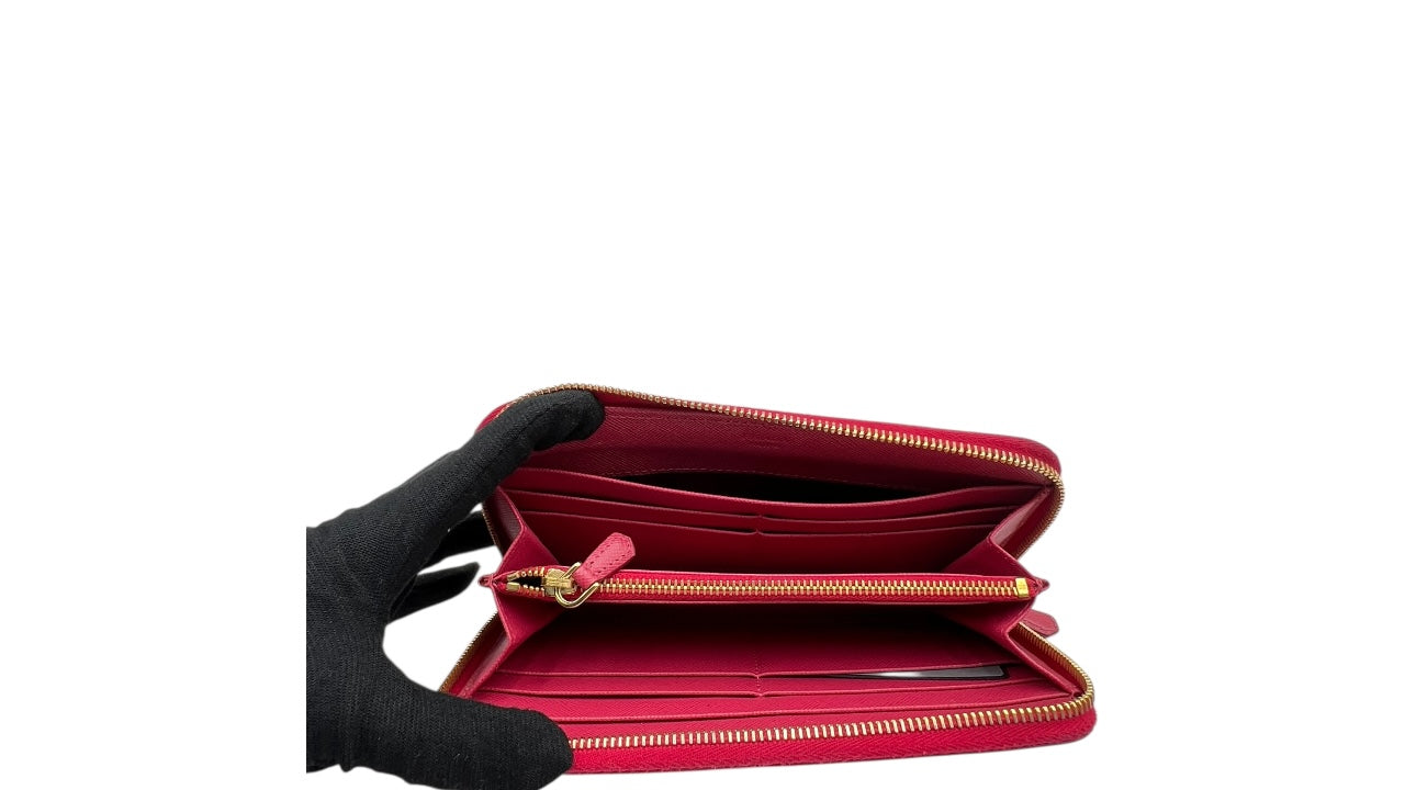 PRADA SAFFIANO LEATHER ZIPPY WALLET IN DEEP PINK