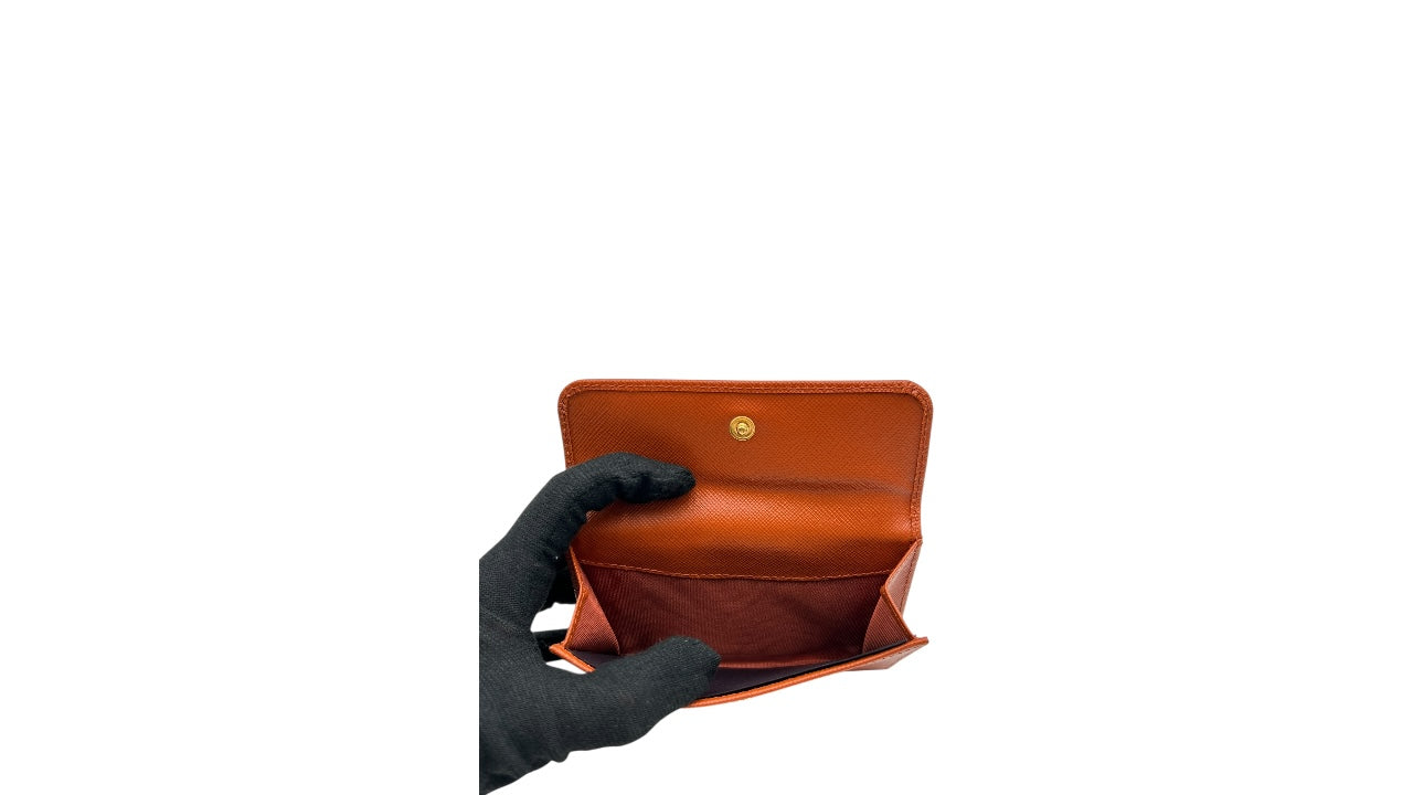 PRADA SAFFIANO LEATHER SHORT WALLET IN PUMPKIN SPICE