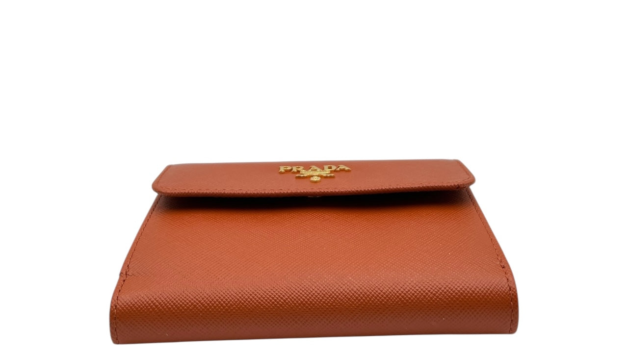PRADA SAFFIANO LEATHER SHORT WALLET IN PUMPKIN SPICE